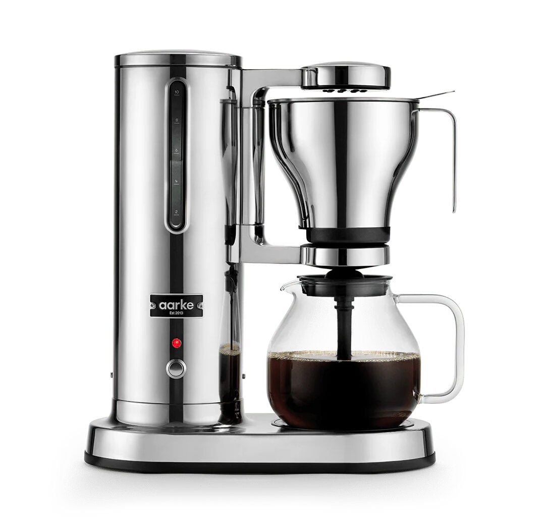 Image of the Aarke Coffee Maker in stainless steel full of coffee.