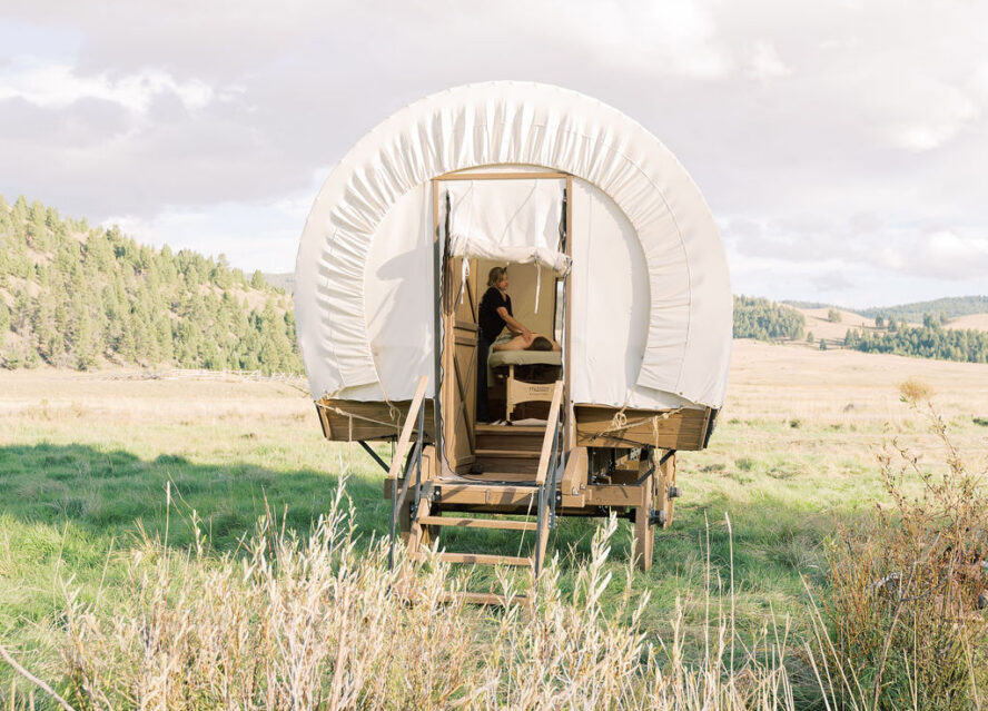 Image of the spa massage table inside the Creekside Conestoga Wagon at The Ranch at Rock Creek.